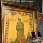 Pyhän Ksenia Pietarilaisen ikoni ja lampukka