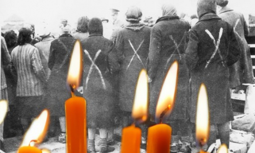 Naisvankeja Ravensbrückin keskistysleirillä ja palavat tuohukset